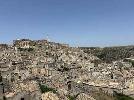 Matera, Italy. Its most distinctive feature is its ancient cave dwellings, known as "sassi," which are carved into the rock and form a unique urban landscape.の写真素材