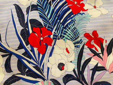 Fabric with a delicate floral pattern, close-up as texture. Old-fashioned cotton or linen textile in...