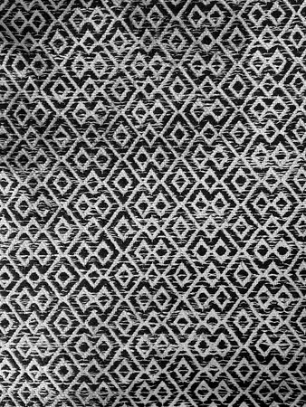 Black and white geometric fabric texture with diamond shapes in a seamless pattern. Perfect for...