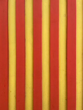 Abstract background with vertical red and yellow stripes. Bold geometric pattern with bright contrasting colors, perfect for modern design, graphic backgrounds, and creative visualの写真素材