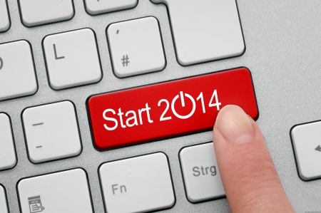 Red button to start the new year of 2014 on computerの写真素材