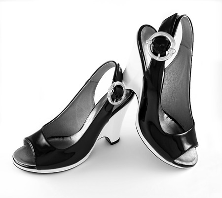 Stylish high-heeled black shoes isolated on white backgroundの写真素材
