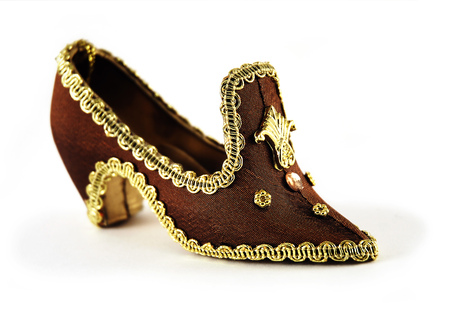 Miniature princess shoe isolated on whiteの写真素材
