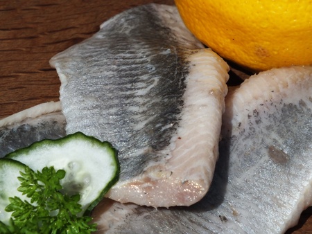 Matjes, Herring, on a board from oakの写真素材