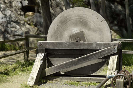 close view of an antique millstone in a western country town of California, USAの写真素材