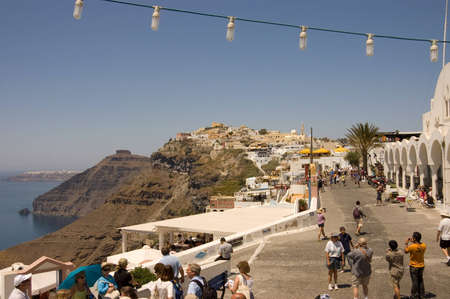 SANTORINI - JULY 7: street scene with tourists at Fira village in Santorini island, Greece, 7th July 2007のeditorial素材