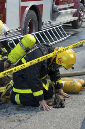 QUEBEC, CANADA - AUGUST 30TH; Firefighters rescuing each other, Quebec, Canada, 30th August 2006のeditorial素材