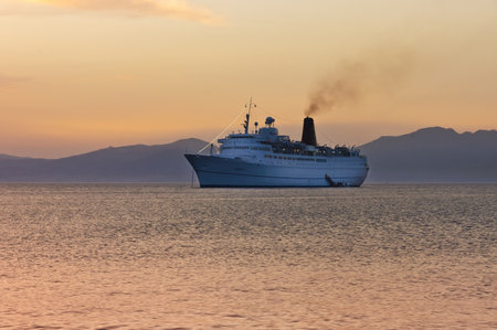 Myconos, Greece - May 7th, 2007; cruiser ship sailing on Aegean sea, near Myconos, Greece at twilightのeditorial素材