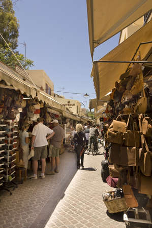 Chania, Greece  - MAY 11TH; Tourists shopping in the narrow pedestrians street of Chania, Crete, Greece, 11 May 2007のeditorial素材