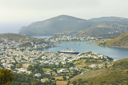 Patmos, Greece - May 8th, 2007; cruise ship anchored in pier of  Patmos, and scenic view of of  town of Skala, Greeceのeditorial素材