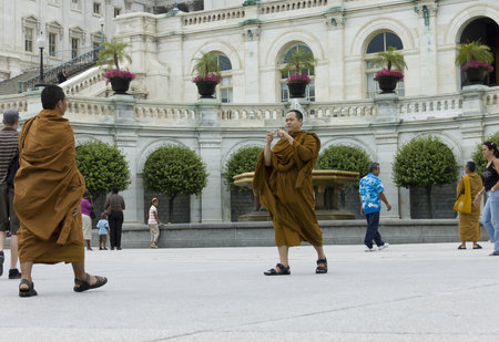 Washington DC, USA - June 25th, 2007 : monks buddhists taking pictures  in front of Capitol,...