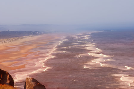Oregon, USA - May 13th, 2006 : Sandy beach sunset over the pacific in Oregon, USAのeditorial素材