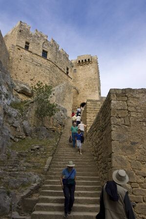 Lindos, Greece - May 9th, 2007 :Tourists going up to the Lindos Acropolis, Lindos, Greeceのeditorial素材