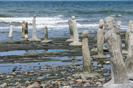 The Great Gathering - stonework statues leading into the St. Laurence River  in Sainte-Flavie, Gaspesia, Quebec, Canada.の写真素材
