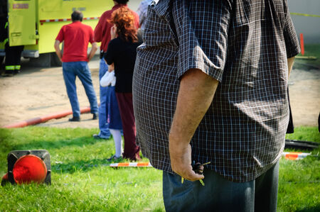 snapshot of an overweight man on street of  rural country, Quebec, Canada