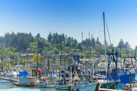 Newport, Oregon, USA - May 13th, 2006 :scenic view of Fishermen boats anchored in port of Newport and urban view, Oregon,USAのeditorial素材