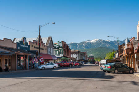Whitefish, Montana, USA - May 29, 2009 : view of the main street of Whitefish city with houses, stores, carsのeditorial素材