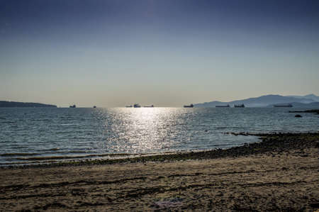 oil tankers moving  at  Port of Vancouver at twilight, British Columbia, Canadaの写真素材