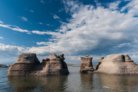 Monoliths on a cloudy sky  in  Mingan Archipelago National Park Reserve of Canada,Quebec, Canadaの写真素材