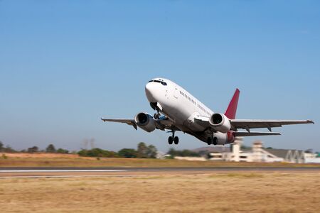 Departing aircraft with bleu skyの写真素材