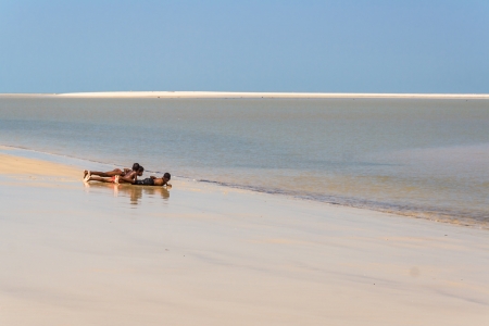 Malagasy children playing on oct 29, 2007 on te beach of Morondava, east of Madagascarのeditorial素材