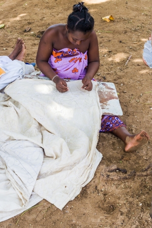 Malagasy woman of Nosy Be, Madagascar, embroidery tablecloths at work Nosy Komba on apr 4, 2008のeditorial素材
