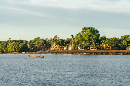 NOSY BE, MADAGASCAR - APR 4: unidentified malagasy people going fishing in an outrigger canoe on april 4, 2008のeditorial素材
