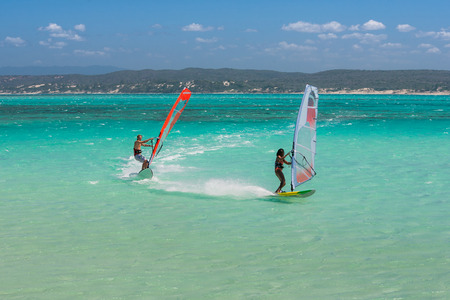 Couple of windsurfers in the vastness of the lagoonの写真素材