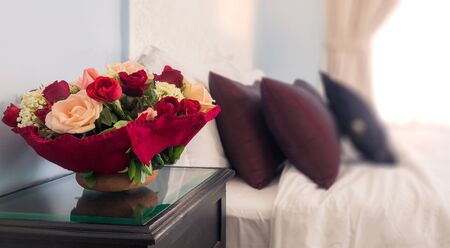 Bouquet of flowers on the hotel nightstandの写真素材