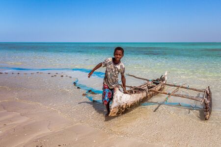 Return fishing of a young Vezo fisherman and his outrigger canoe in Tsiandamba, south of Madagascar, on july 22, 2016のeditorial素材