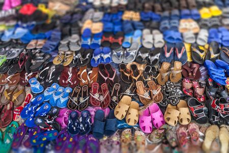 Display of shoes in a street market of  Madagascarの写真素材