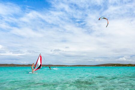 Antsiranana, Madagascar, july 9, 2017: A couple windsurfer and kitesurfer playing in the lagoon of Antsiranana bay (Diego Suarez)のeditorial素材