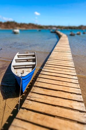Outrigger canoe on the pontoon of the Diego Suarez's marina (Antsiranana), north of Madagascarの写真素材