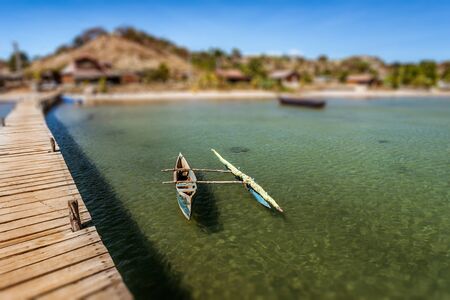 Outrigger canoe on the pontoon of the Diego Suarez's marina (Antsiranana), north of Madagascarの写真素材