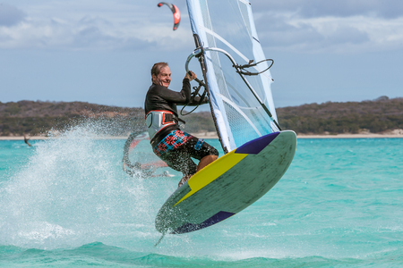 Kitesurfer jumping on the turquoise lagoonの写真素材