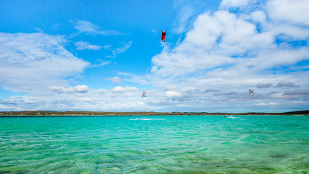 Kitesurfer jumping on the turquoise lagoon of Diego Suarez, Madagascar.の写真素材