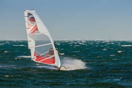 Woman windsurfing in the lagoonの写真素材