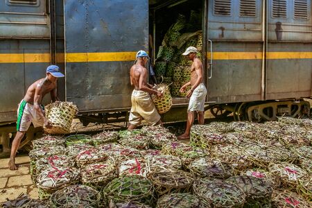 Fianarantsoa, Madagascar, March 7, 2013: Loading goods in the train Fianarantsoa - East Coast (FCE),...