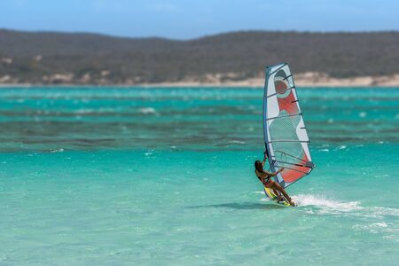 Women's windsurfer surfing in the lagoonの写真素材