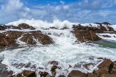 Powerful waves crushing on a rocky beach