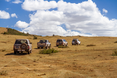Vohemar, Madagascar, May 23, 2017: Four vehicles off-road in a field of grass near Vohemar in Eastern Madagascarのeditorial素材