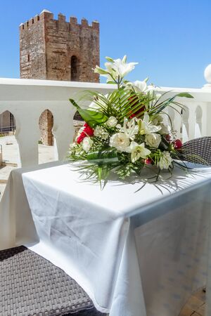 Small terrace decorated with a bouquet of flowers in the medina of Tangier, Moroccoの写真素材