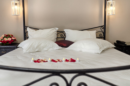 Deluxe doube room with a wrought iron bed in Moroccan styleの写真素材
