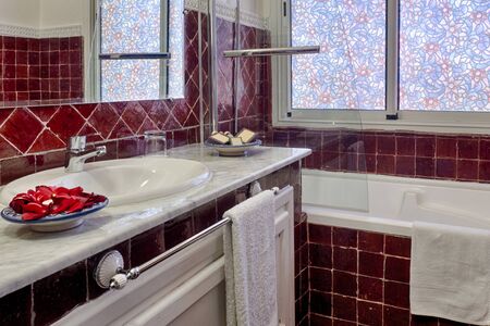 Romantic bathroom of luxury hotel with petals  decorationの写真素材