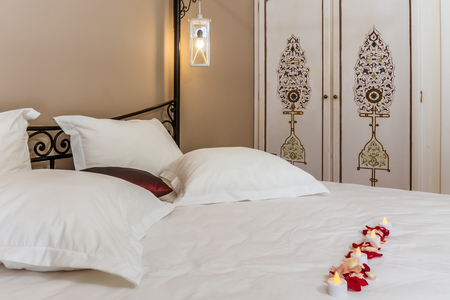 Deluxe doube room with a wrought iron bed in Moroccan styleの写真素材