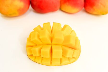Mango cubed isolated on white backgroundの写真素材