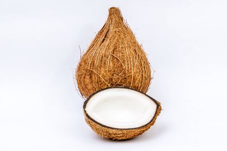 Ripe coconut open isolated on white backgroundの写真素材