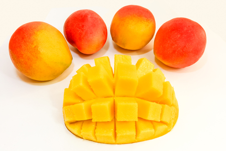 Mango cubed isolated on white backgroundの写真素材