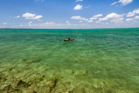 Malagasy fisherman in his outrigger canoe in the lagoon of Andavadoaka, Southwestern Madagascar on October 25, 2016のeditorial素材