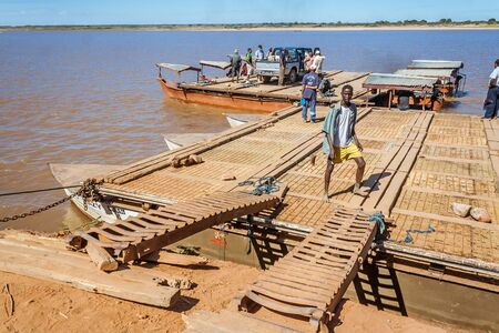 People waiting ferry  on july 3, 2017 on the landing stage of Belo sur Tsiribihina, western Madagascarのeditorial素材